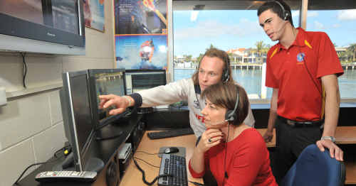 Premier Anna Bligh checks out the Parkyn Parade lifeguard command centre. Showing her the ropes are lifeguard Beau Farrell (left) and Surf Com operator Sebastian DePaula. Premier Anna Bligh checks out the Parkyn Parade lifeguard command centre. Showing her the ropes are lifeguard Beau Farrell (left) and Surf Com operator Sebastian DePaula.